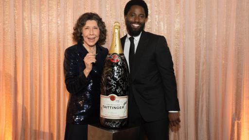 John David Washington & Lily Tomlin add their signatures to Champagne Taittinger’s bottle activation at the 25th Annual Screen Actors Guild Awards on January 27, 2019.