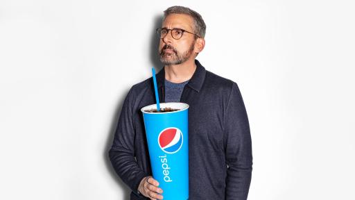 Steve Carell holding an oversize cup of Pepsi