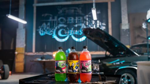 Brisk bottles in front of a car