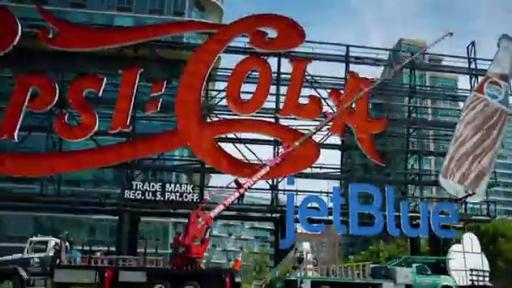 Boomerang: Installation of the temporary JetBlue signage placed on the landmark Pepsi-Cola sign in Long Island City, New York.
