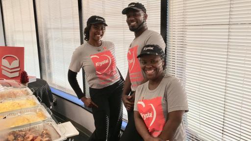 Three Krystal employees posing.