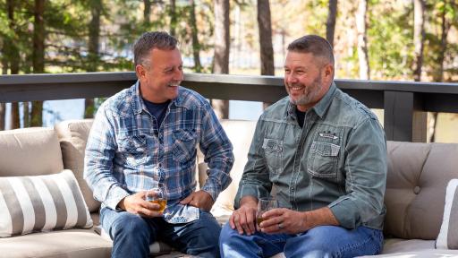 Designer Cottage homeowners, Jack and Harlen, enjoying the view from their porch.