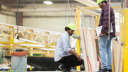 Students working on pre-fab buildings