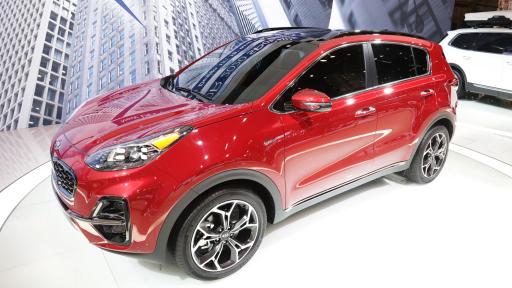A red 2020 Kia Sportage at the auto show