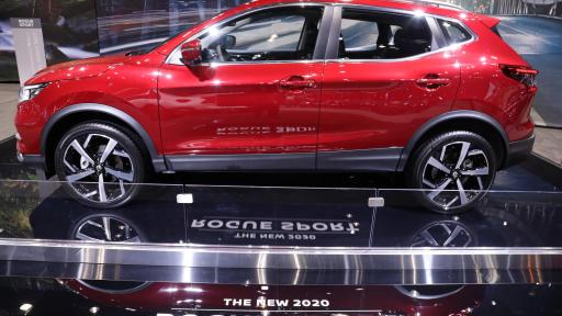 A side profile of a Nissan Rogue Sport at the auto show