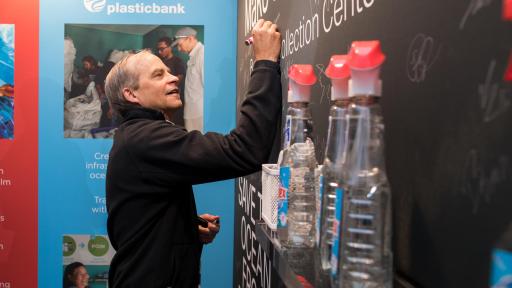 Fisk Johnson signs a wall.