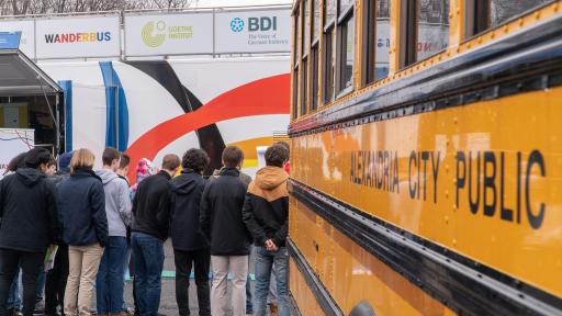 Kids wait outside near bus