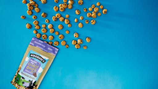 Cookie Dough Chunks spilling out of the package on a blue background