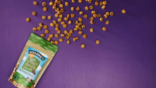 Cookie Dough Chunks spilling out of the package on a purple background