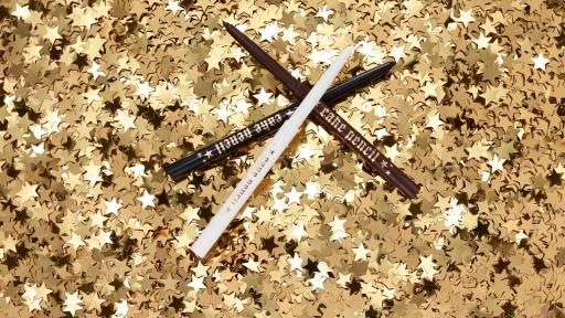 New Cake Pencils atop a pile of confetti stars