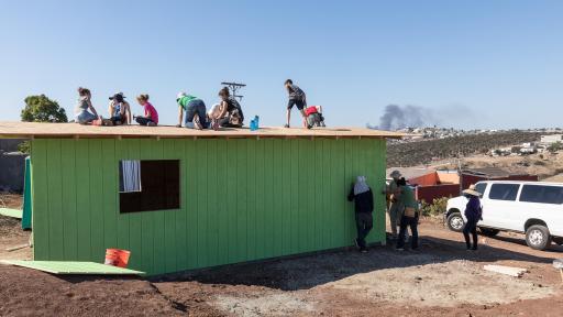 People building house