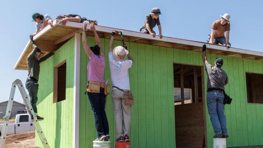 People building house
