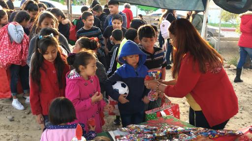 Children in line waiting for meals.