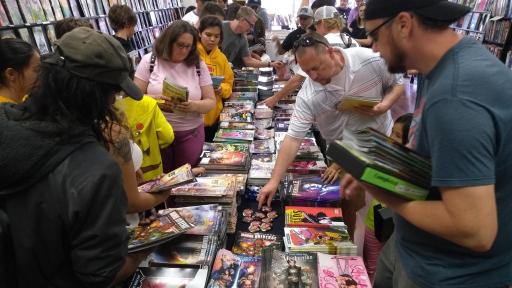 People looking through comic books.