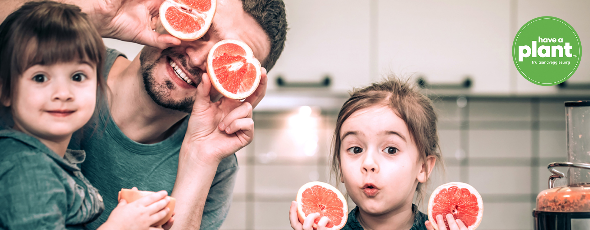 Family playing with orange slices