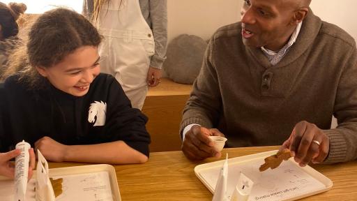 People making gingerbread men cookies