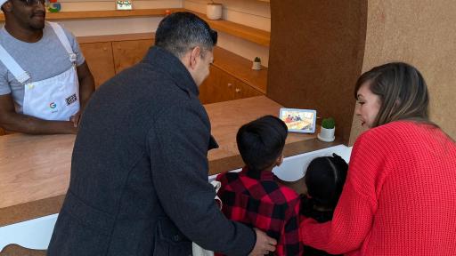 A family watching a video on a device