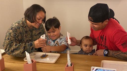 Military families enjoy USO Holidays programming that includes cookie decorating and ornament making stations, family photo opportunities, writing letters to Santa, a hot cocoa bar and more.