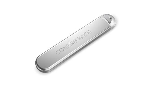 A product photo of the silver medical device, that looks like a flattened thumb drive.