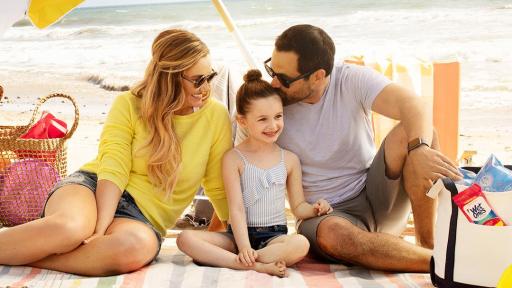A family posing for a picture on the beach