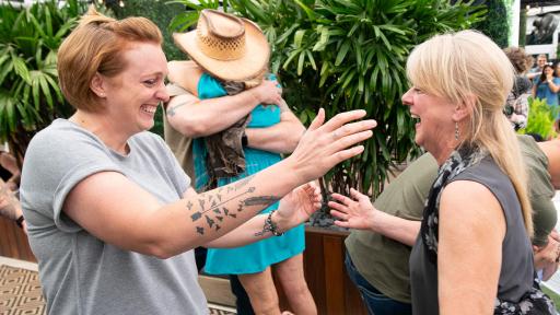 Two women about to hug