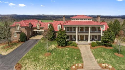 Front view of a large sprawling mansion on Carlise Hill.
