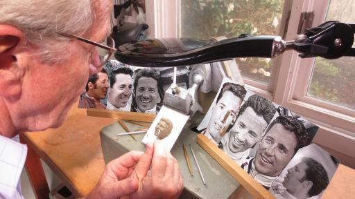 Sculptor William Behrends sculpts Mario Andretti&rsquo;s face from photographs for the Baby Borg trophy