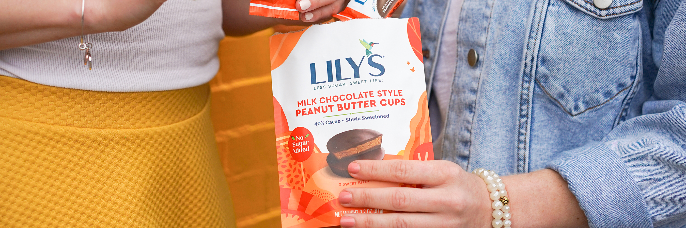 People sharing a bag of Lily's Sweets Peanut Butter Cups