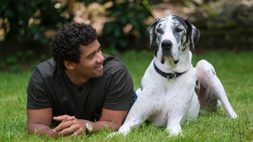Pro football champion and pet advocate Russell Wilson enjoys a moment with his dog, Naomi, while filming the Safer Together™ public service announcement (PSA) with the Banfield Foundation® on Wednesday, May 15, 2019, in Redmond, Wash. Ahead of National Domestic Violence Awareness Month, the PSA will debut in September to help raise awareness that pets, too, are often victims in homes where domestic violence occurs. Many domestic violence victims stay in abusive situations because they fear for the safety of their pet, so the Banfield Foundation aims to educate and provide resources for pet owners, advocates and communities to help make a difference for pets and the people who love them. (Photo credit: Stephen Brashear/AP Images for the Banfield Foundation)