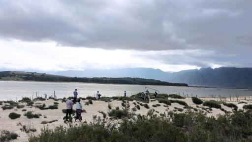Filming under heavy overcast on the shore of a lake
