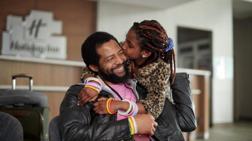 A daughter hugging her father