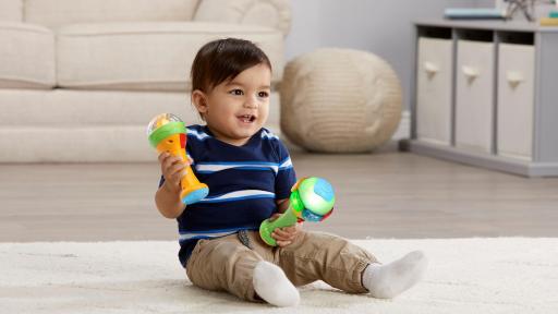 Boy playing with the LeapFrog&reg; Learn & Groove&reg; Shakin' Colors Maracas&trade;