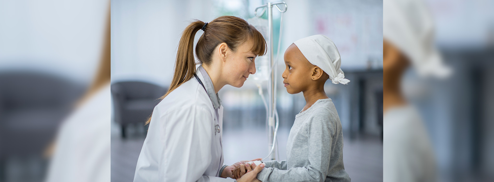 A caregiver holding hands of patient