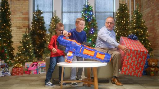Man with children looking at toys