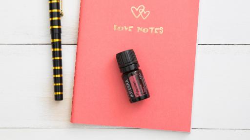 Passion oil atop notebook