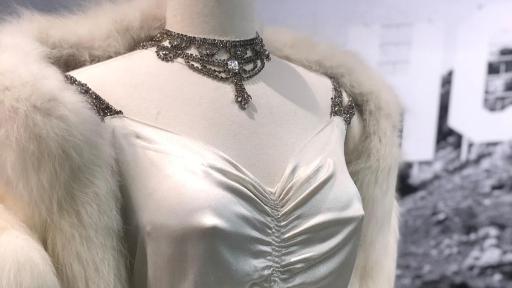 Gene London Costume of a white dress with fur wrap.