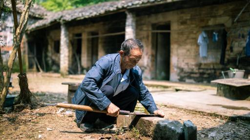 Mr Qi is sharpening a blade.