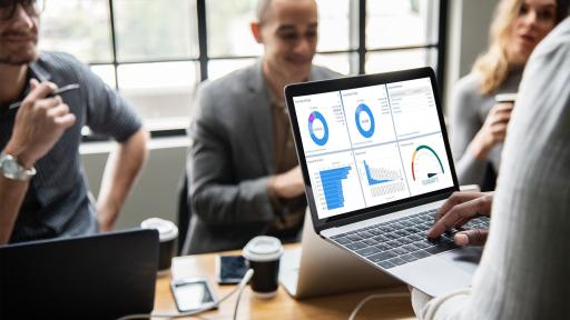 Person on laptop in a meeting