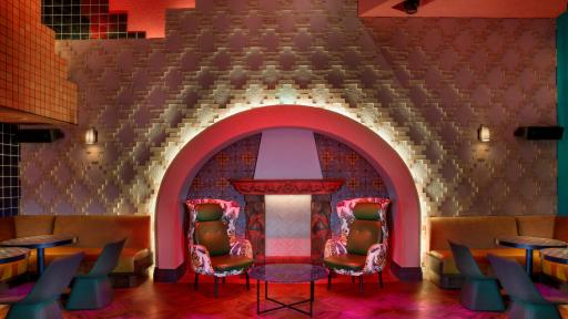 Hand Carved Fireplace by Renzo Spada in Mama Rabbit Bar’s Lounge