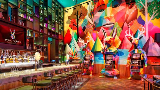 Mural and Sculptural Slot Machines by Okuda San Miguel at Mama Rabbit Bar at Park MGM in Las Vegas