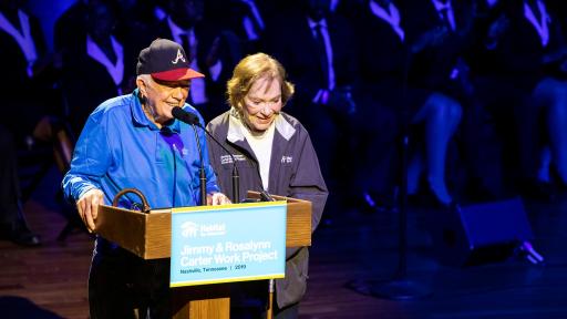 Jimmy and Rosalynn Carter giving a speech for Habitat for Humanity