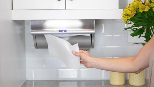 The Innovia Paper Towel Dispenser dispensing a paper towel