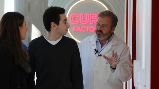 A doctor talking to cancer survivor and mother