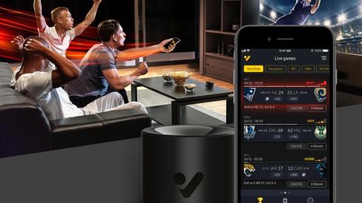 App front of guys watching TV