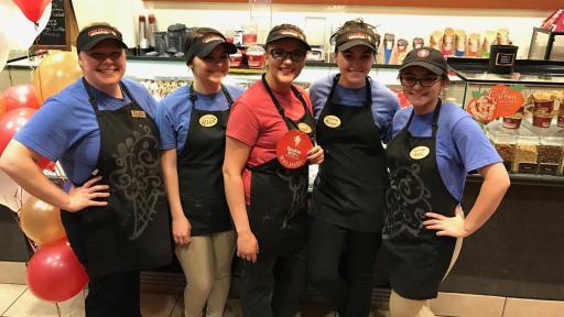 Cold Stone Creamery workers in front of ice cream case