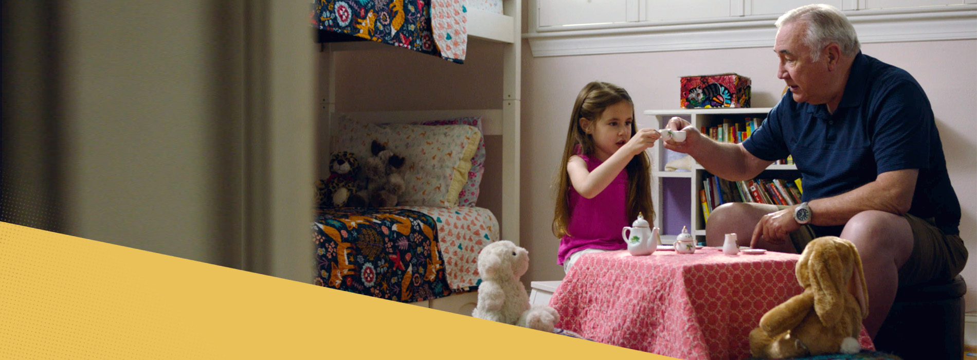 Grandfather and granddaughter playing tea time