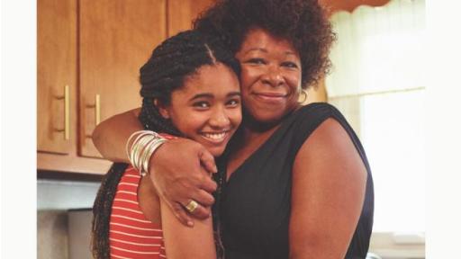 Adopt US Kids poster of a woman hugging a child.