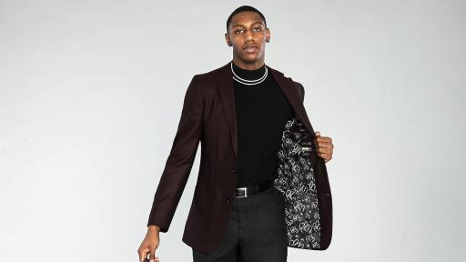 RJ Barrett in Tweed Burgundy Blazer with Signature Lining holding a leather bag