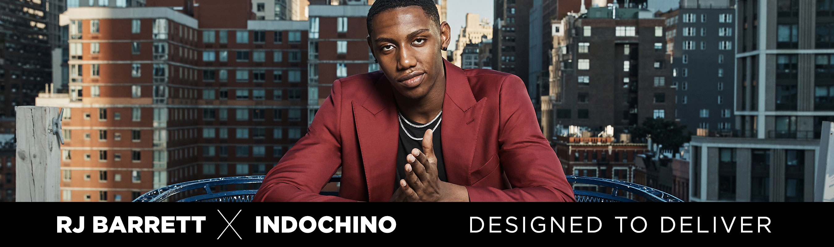 RJ Barrett posing, buildings in background