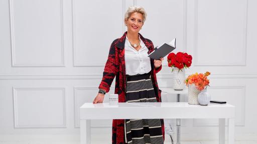 Woman standing behind a desk
